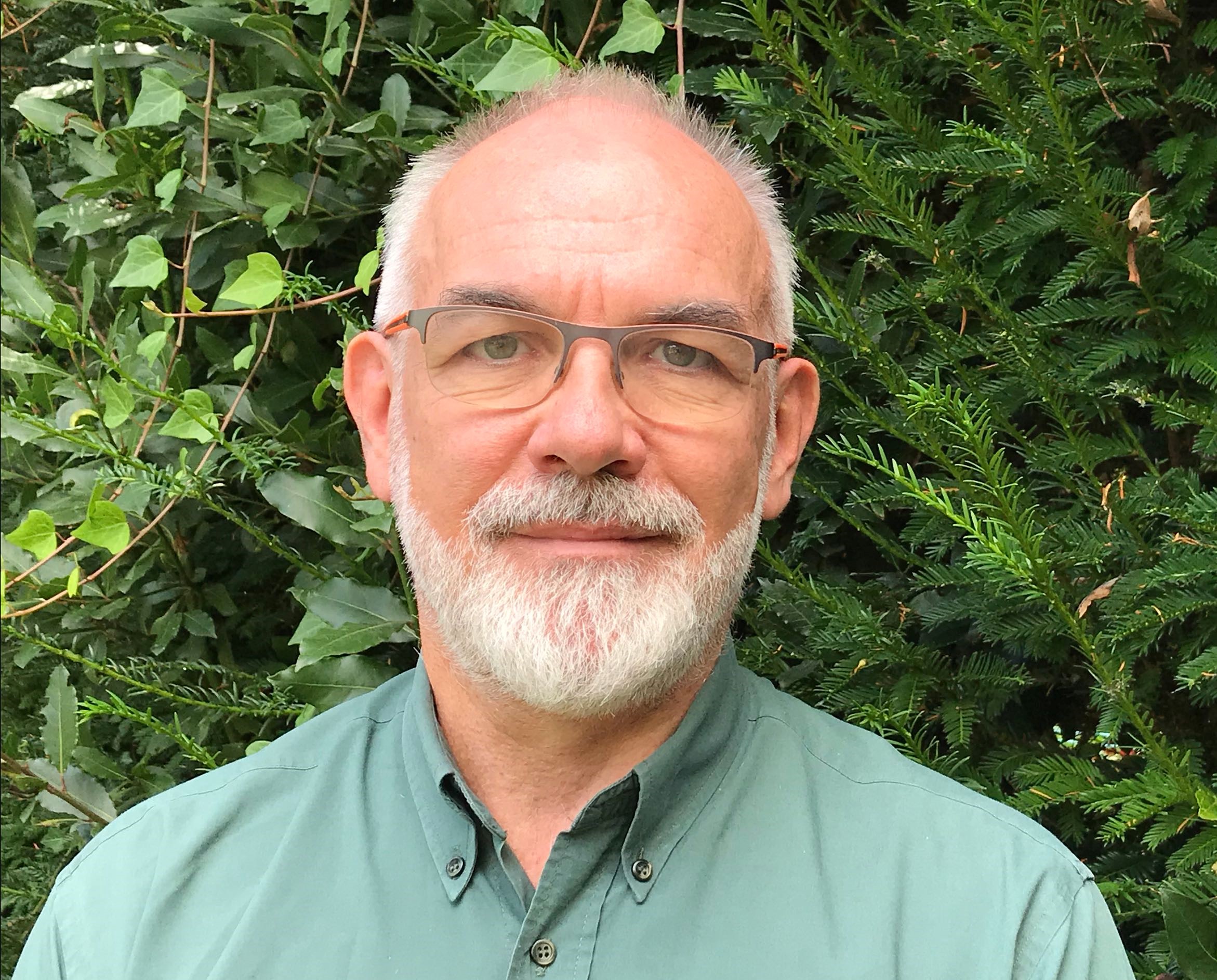 A photo of J-F Rouet in a green shirt